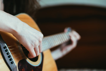 Girl playing the guitar.