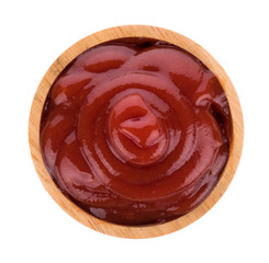 tomato sauce in wooden bowl isolated on white background