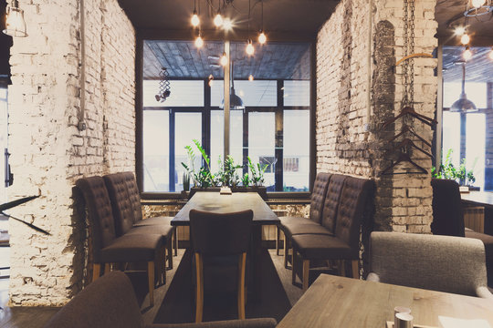 Cozy dining place at window, restaurant background