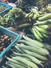 Different raw of fresh organic vegetables and fruit at local farmers market in The north of Thailand. Healthy eating. vintage tone color and  retro filter.