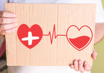     Blood donation symbol, two hearts connected with pulse cardiogram 