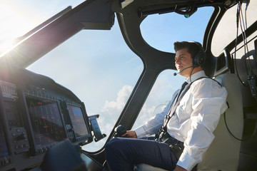 Pilot In Cockpit Of Helicopter During Flight