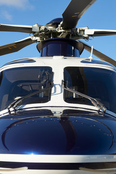 Exterior Front View Of Helicopter Cockpit And Rotor Blades