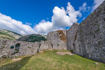 Fototapeta na wymiar Courtyard in front of one of towers of Stari Bar fortress near Bar city in Montenegro