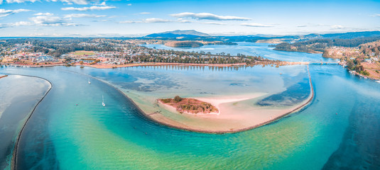 Aerial panorama of shallow ocean water and coastline. Narooma, NSW, Australia
