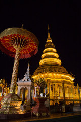 Scenery night view of the golden pagoda of Wat Phra That Hariphunchai temple at Lamphun, Thailand