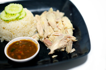 Hainanese chicken rice rice topped with chicken