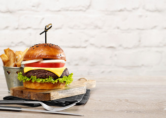 Cheeseburger with fries - obrazy, fototapety, plakaty