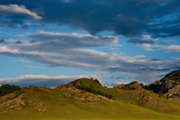 Fototapeta na wymiar Sunset in the steppes of the Altai mountains