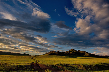 Fototapeta na wymiar Sunset in the steppes of the Altai mountains