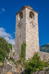 Renovated tower clock among ruins of Stari Bar fortress near Bar city in Montenegro