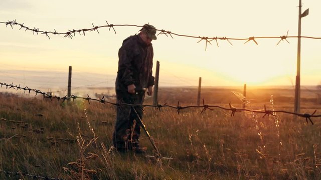 The military works with a mine detector. Search for mines and explosives in the danger zone.