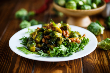 Brussels sprouts fried with beans close-up