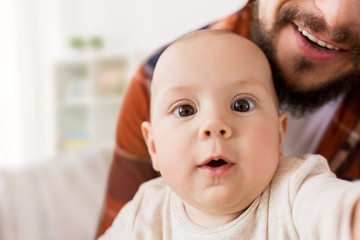 close up of happy little baby boy with father
