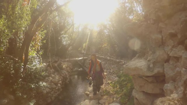 girl is walking in ruins of two thousand-year-old city of Olympos, Lycia, Lycian trail