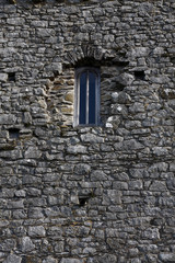 Fototapeta na wymiar Old window in a stone building