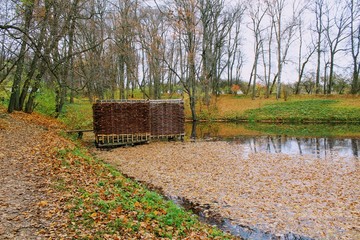 A bath woven from a willow twig on the estate of Leo Tolstoy in Yasnaya Polyana and a small pond.