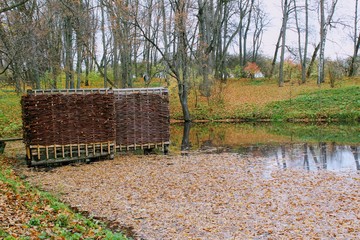 A bath woven from a willow twig on the estate of Leo Tolstoy in Yasnaya Polyana and a small pond.
