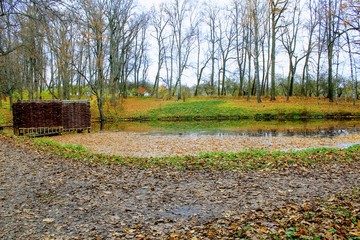 A bath woven from a willow twig on the estate of Leo Tolstoy in Yasnaya Polyana and a small pond.