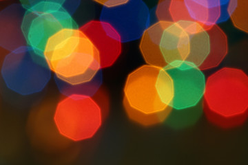 background of festive blurred glittering shine bulbs of lights, abstract defocused christmas lights with bokeh