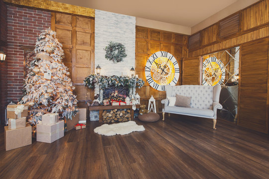 Cozy christmas interior with fir tree and fireplace