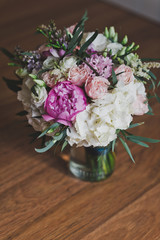 A bouquet of flowers on the table in a vase 8819.