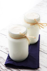 greek yogurt in glass jar. natural creamy yoghurt.
