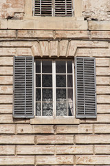 Gubbio, Perugia, Italy -  Piazza Grande, in Gubbio, architectural details of the ancient palaces