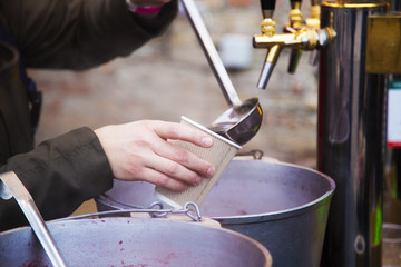 Hot wine at a street market, glintwein, mulled wine