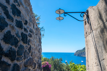 A summer day visiting Aragonese Castle and looking toward Capri and Vesuvi Ischia Ponte, Ischia,...