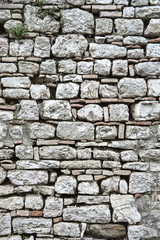 Gubbio, Perugia, Italy -   ancient wall in a small typical street of the Gubbio village.