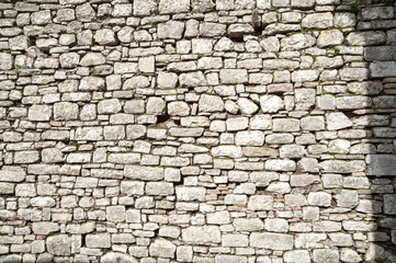 Gubbio, Perugia, Italy -   ancient wall in a small typical street of the Gubbio village.