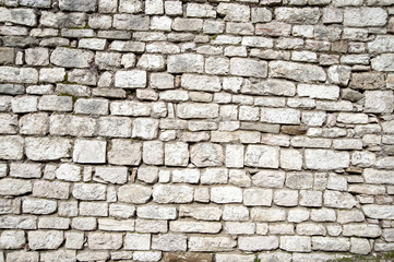 Gubbio, Perugia, Italy -   ancient wall in a small typical street of the Gubbio village.