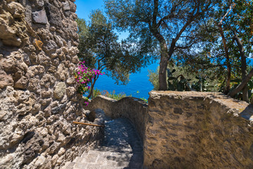 A summer day visiting Aragonese Castle and looking toward Capri and Vesuvi Ischia Ponte, Ischia,...