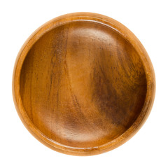 Empty wooden bowl. Small brown bowl with wood grain in simple design. Round open-top container for storing food and non-food items. Isolated macro photo close up from above on white background.