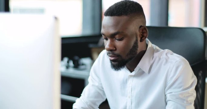 Portrait Black Man Working Use Computer Feel Happy Smile Looking In Monitor Screen Office Technology African American Businessman Casual Communication Successful Portrait Business Slow Motion Shot