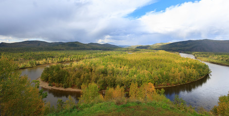 Fototapeta na wymiar beautiful autumn landscape with river and forest under blue sky