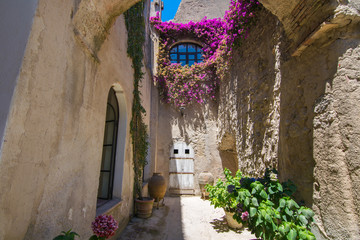 A summer day visiting Aragonese Castle and looking toward Capri and Vesuvi Ischia Ponte, Ischia,...