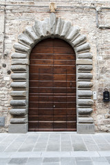 Gubbio, Perugia, Italy -  entrance door, architectural details of the ancient palaces