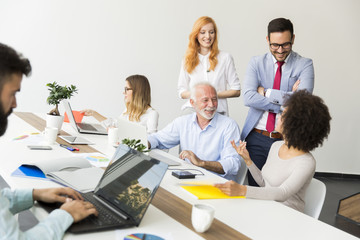 Multiracial young business people working in office