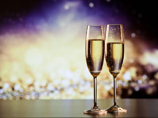 two champagne glasses ready to bring in the New Year