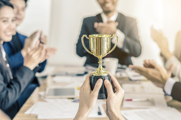 winning business team gold trophy , business team happy consent and successful business team...