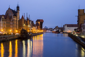 Views of the Old City of Gdansk, Poland, at night, with Saint Mary's gate (Brama Mariacka), the medieval crane gate (Brama Zuraw), and the Motlawa river