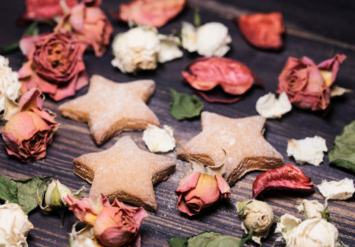 Beautiful background made from dried flowers and leaves and cookies