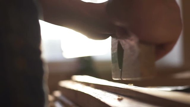 Carpenter planed wood, workplace. Slow motion