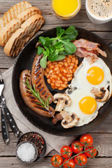 English breakfast. Fried eggs, sausages, bacon