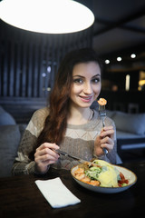 Beautiful girl in a cafe 