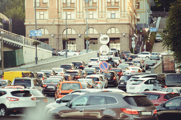 big traffic jam on the road in the city, cars are standing