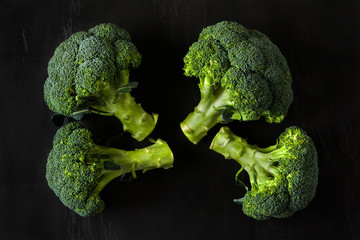 broccoli isolated on a black stone background