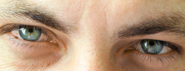 Attractive, blue eyes thirty-year-old man's close up.
